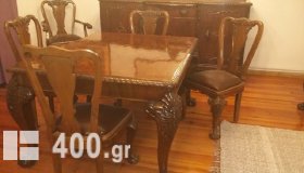 Πωλείται  Σετ Τραπεζαρίας(επεκτείνετε) και σερβάντας(μπουφέ) με 6 καρέκλες και 2 πολυθρόνες ξύλο/δέρμα απο μασιφ χειροποίητη σκαλιστή καρυδιά με λεοντοπόδαρα χρονολογίας 1955